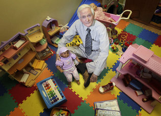  Dr. Robert Nolan, executive director of Miami-Dade’s Institute for Child and Family Health,  is surrounded by toys he uses in his work with children. 